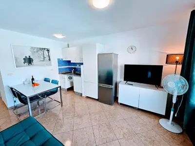 Una televisión o centro de entretenimiento en Eagle View Mar Paraiso