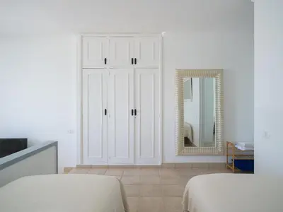 Cama o camas de una habitación en Nidos Suites San Agustin