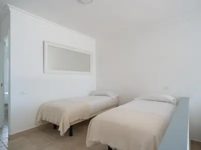 Cama o camas de una habitación en Nidos Suites San Agustin