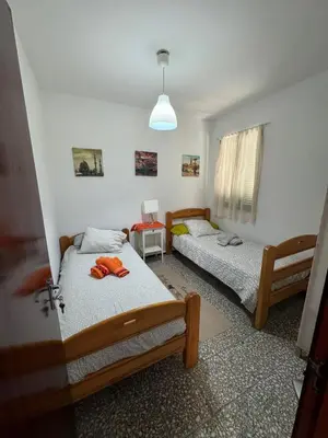 Cama o camas de una habitación en La casita de Bécquer Habitaciones compartidas