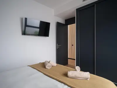 Cama o camas de una habitación en Completo Apartamento con gimnasio playa de Las Canteras A1D