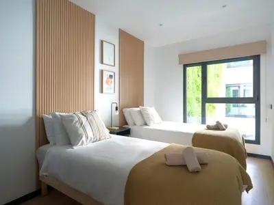 Cama o camas de una habitación en Gran apartamento cerca de playa Las Canteras con gimnasio A3B