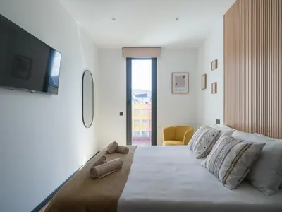 Cama o camas de una habitación en Gran apartamento cerca de playa Las Canteras con gimnasio A3B