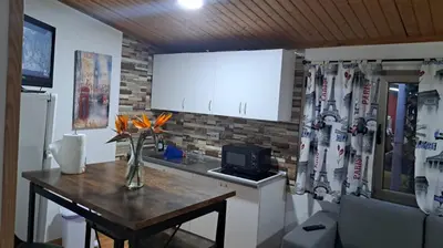 Una televisión o centro de entretenimiento en Villa Olga Rosa