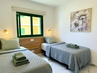 Cama o camas de una habitación en Las Olas Canarias