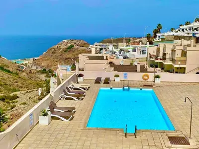 Piscina en o cerca de Beautiful sunset view apartment in Puerto Rico