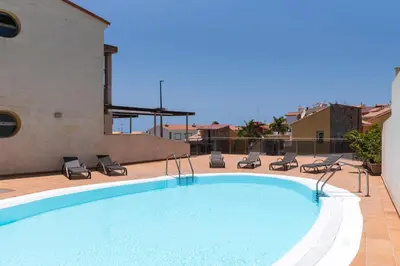 Piscina en o cerca de Cozy 2BR Retreat With Big Terrace, Peaceful Stay Minutes Away From the Beach