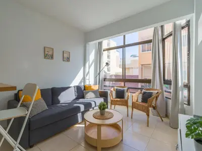 Zona de estar de Cozy Nearby Flat Las Canteras