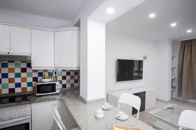 Una cocina o zona de cocina en Coral Canteras Playa - Frente al mar - Ideal parejas, familias o trabajo