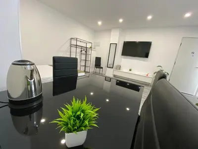 Una televisión o centro de entretenimiento en Loft La Jirafa