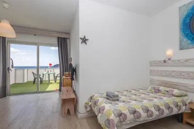 Cama o camas de una habitación en Penthouse Turismar Loft-Terrace & OceanView