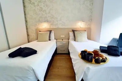 Cama o camas de una habitación en The Poet´s Corner Holiday Home