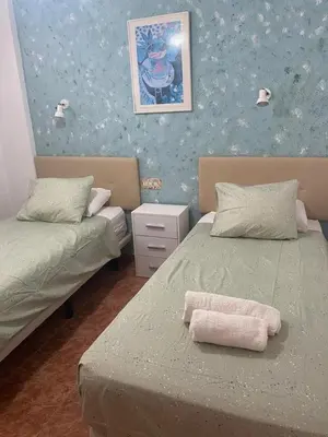 Cama o camas de una habitación en Don Quijote - Apartamento a pasos de la playa