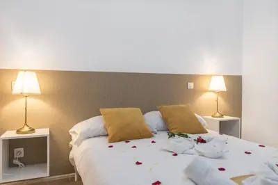 Cama o camas de una habitación en Home2Book Charming Rooftop Vibes Apartment