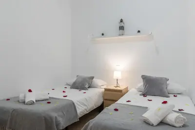 Cama o camas de una habitación en Home2Book Charming Rooftop Vibes Apartment