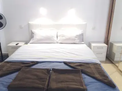 Cama o camas de una habitación en TUNERAS SUNSET Puerto Rico Apartment