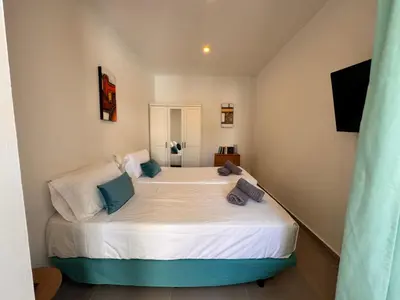 Cama o camas de una habitación en Rainbow home Yumbo 3