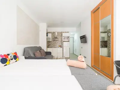 Cama o camas de una habitación en Apartment by Playa de Las Canteras Beach