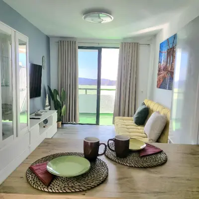 Una televisión o centro de entretenimiento en Suite Paradise Puerto Rico