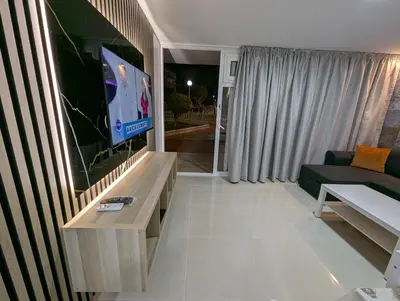 Una televisión o centro de entretenimiento en Apartamentos Anau k & L- Playa del inglés - Yumbo