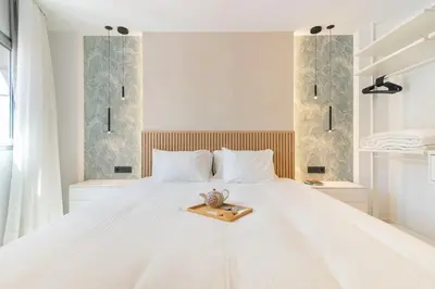Cama o camas de una habitación en Home2Book Stylish Beachfront Escape