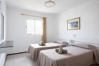 Cama o camas de una habitación en Apartamentos las Góndolas