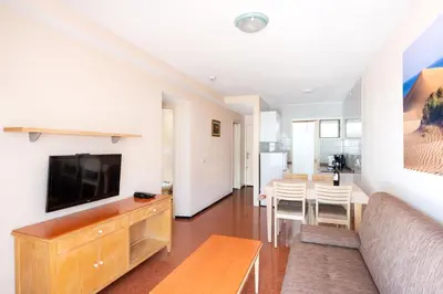 Una televisión o centro de entretenimiento en Apartamentos las Góndolas