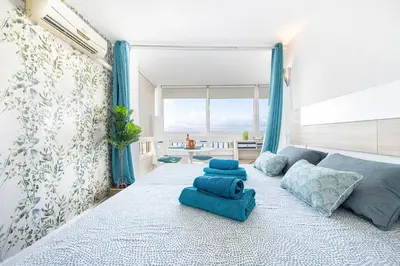 Cama o camas de una habitación en Gran Ventanal El Crucero renovado frente al Mar