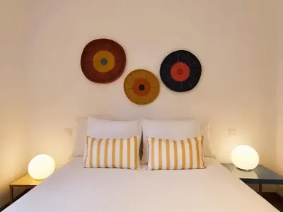 Cama o camas de una habitación en Stylish & cozy home by the beach