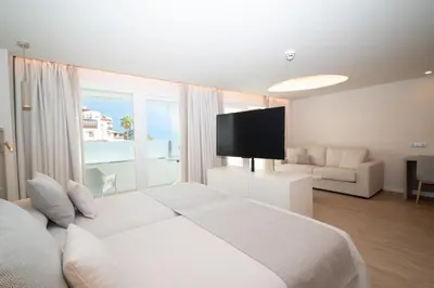 Cama o camas de una habitación en Hotel Sahara Playa
