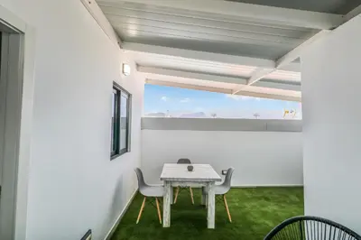 Una televisión o centro de entretenimiento en Living Central Stay Bejeque