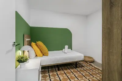 Cama o camas de una habitación en Living Central Stay Bejeque