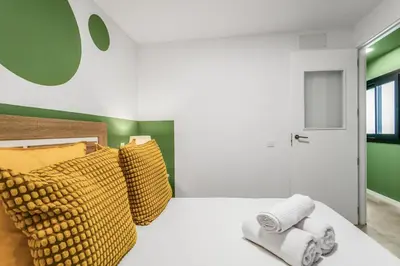 Cama o camas de una habitación en Living Central Stay Bejeque