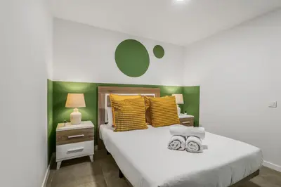Cama o camas de una habitación en Living Central Stay Bejeque