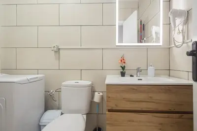 Un baño de Apartamentos L O L A Arguineguin