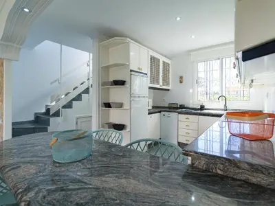 Una cocina o zona de cocina en Timon Beach Suites San Agustin