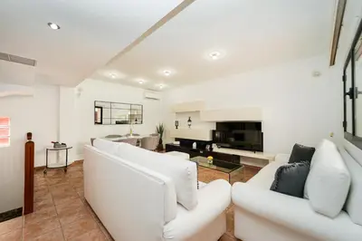 Una televisión o centro de entretenimiento en Villa Vistabella by Maspalomas Holiday Villas