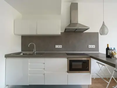 Una cocina o zona de cocina en Ferreras Suites Las Canteras