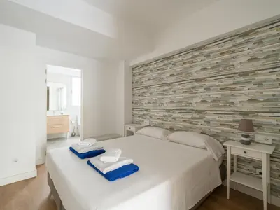 Cama o camas de una habitación en Ferreras Suites Las Canteras