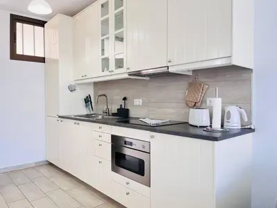 Una cocina o zona de cocina en Penthouse on the Ocean by Alquiler de Sueno