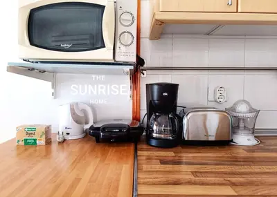 Una cocina o zona de cocina en The Sunrise Home Sea views and terrace house with barbecue