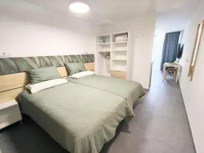 Cama o camas de una habitación en Green Day by Casas Cocodrilo