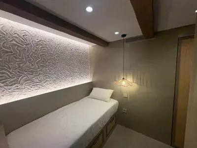 Cama o camas de una habitación en Precioso apartamento de playa con jardín privado
