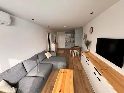 Una televisión o centro de entretenimiento en Luxury Ocean View Patalavaca Apartment