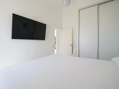 Cama o camas de una habitación en FaroQuilla Suites Pasito Blanco