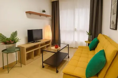 Una televisión o centro de entretenimiento en Apartamento elegante y tranquilo con encanto