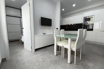 Una televisión o centro de entretenimiento en Fontanales Beach Flat