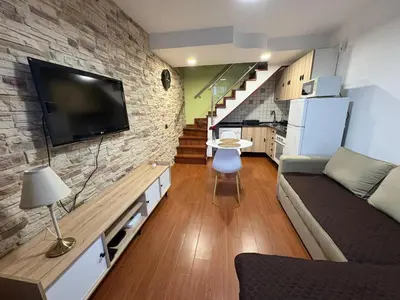 Una televisión o centro de entretenimiento en Apartamento Maspalomas - Playmar