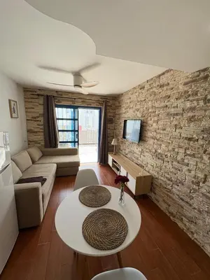 Una televisión o centro de entretenimiento en Apartamento Maspalomas - Playmar