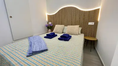 Cama o camas de una habitación en Carolina apartment, two bedrooms with air conditioning and a fully equipped kitchen, close to the beach and shopping center